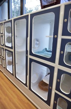 an empty refrigerator is shown in the middle of a room with several shelves on each side