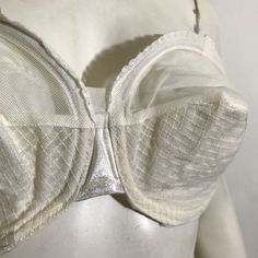 1950s white sheer circle cup bullet bra with overbust and underbust wire by Charmode. Lace trim, double straps in back with hooks- 28-33" around, 8" across inside of cup. Missing shoulder straps.