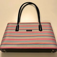 This Kate Spade Satchel Styled Bag Is Beautiful. Striped Pattern Of Vivid Pinks,Blues N White. Black Leather Black Zipper N Some Trimming. Interior Has 2 Large Open Sides. 1 Large Center Pocket W/Zipper Closure. Interior Has 1 Pockets On The Side For Phone Or Keys.. 10 1/2in Handles. Please See All Pictures Above..I Purchased From @Markettaschreck. Loved It, But Ready To Rotate For Something New. Thank You For Visiting My Closet Stop N Shop Anytime Reasonable Offers Only Please. Questions? Pleas Kate Spade Pink Bag With Top Carry Handle, Pink Office Bag With Handles, Kate Spade Pink Tote Shoulder Bag, Kate Spade Pink Shoulder Bag For Travel, Pink Kate Spade Shoulder Bag For Travel, Kate Spade Multicolor Tote Bag, Kate Spade Pink Satchel For Daily Use, Kate Spade Multicolor Shoulder Bag For Travel, Kate Spade Pink Double Handle Shoulder Bag