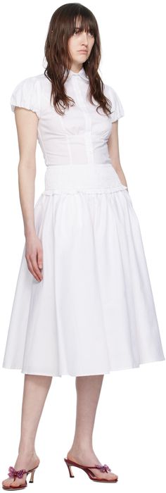 Stretch cotton poplin skirt. Gathering throughout. · Ruffles at shirred elasticized waistband · Two-pocket styling · Fully lined Supplier color: White Cotton Full Skirt With Pleated Waist, Chic Ruched Bottoms For Daywear, Daywear Full Skirt With Ruffles, Full Ruffled Skirt For Daywear, Full Skirt With Ruffles For Daywear, Summer Ruched Bottoms For Daywear, Cotton Skirt With Pleated Waist And Voluminous Fit, Daywear Tiered Skirt With Gathered Waist, Classic Cotton Bottoms With Voluminous Skirt