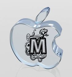 an apple shaped object with the letter m on it's front and bottom side