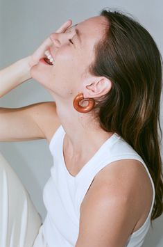 Our Frank Small Chunk Hoops - a tantalizing fusion of rich, slightly muted red tones that evoke the warmth and depth of a well-seasoned spice. These earrings exude a sophisticated charm, effortlessly elevating any outfit to a new level of style. With a touch of artistic flair, the Frank Small Chunk Hoops introduce a unique and versatile accessory to your collection, perfect for infusing your look with a hint of understated allure. The captivating red hue of our Frank Small Hoops is reminiscent o Chic Brown Earrings For Summer, Casual Orange Earrings, Chic Brown Summer Earrings, Chic Red Earrings, Swim Jewelry, Muted Red, Kids Studio, Scarf Jewelry, Classic Beauty