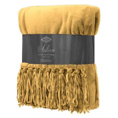 a yellow towel with fringes on it and the word muslim written in black ink