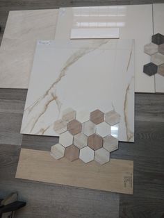 some tiles are laying on the floor next to each other