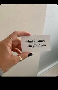 someone holding up a card that says, what's yours will find you?