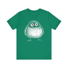 👀 Get ready to fall in love with this adorable Wide-Eyed Fluffy Creature Graphic Tee! Featuring a unique and whimsical design of a round, fluffy creature with big, curious eyes, this shirt is perfect for those who adore quirky and imaginative art. Whether you’re out for a casual day or simply want to add some fun to your outfit, this tee brings a playful and endearing vibe to any look. Let this cute little creature brighten your wardrobe with its wide-eyed charm! 🌟 Why You'll Love It: 👕 Ultim Cute Green Shirt With Funny Print, Fluffy Creature, Imaginative Art, Angry Cat, Meet Friends, Whimsical Design, Just Relax, Leisure Wear, Fashion Lover