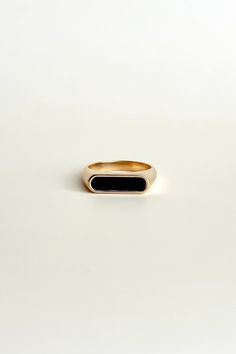 Elevate any outfit with the Emelia Black Ring. Made with 18K gold plating and a black enamel rectangle, this statement ring adds a touch of edginess to your look. Stand out and make a bold statement with this piece! All of our jewelry comes with a free jewelry pouch and cloth to keep your pretties safe and clean. Details Color: 18K Gold PlatedMaterial: Stainless SteelSize: 6, 7, 8 Care Guide Store in a dry, cool place away from sunlight i.e. Blush & Bliss pouch Gently wipe with a soft cloth afte Black Minimalist Signet Ring For Everyday, Elegant Black Enamel Ring As Gift, Elegant Everyday Gold Enamel Ring, Elegant Black Enamel Ring Gift, Black 14k Gold Open Signet Ring, Elegant Gold Signet Ring With Black Enamel, Elegant Black Rectangular Signet Ring, Elegant Onyx Rectangular Signet Ring, Elegant Black Signet Ring For Everyday