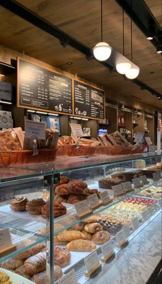 a bakery filled with lots of different types of doughnuts and other pastries