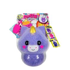 a purple stuffed animal with a horn on it's head