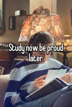 a person sitting in a chair reading a book with the words study now be proud later