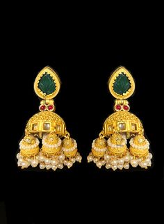 Rudra II - Green Onyx Gold Temple Earrings Classic temple work design jhumka earrings, made with hammered metal and plated with gold. Elegant green Onyx stone stud setting makes this earring jewelry one of a kind. Red Onyx gems add color and grace to this jewelry piece. Luxurious pearl drops enhance this piece making it perfect to be paired with any of your ethnic wear. Approximate earrings 3.5" Details: Handcrafted Metal: Metal Alloy, Gold Plated Stone: Onyx & Pearl Traditional / Modern Clo Brass Temple Jewelry Jhumkas, Kundan Temple Jewelry Earrings, Gold Plated Latkans Temple Earrings, Gold Plated Latkans Temple Jewelry Earrings, Gold Plated Temple Jewelry Earrings With Latkans, Brass Temple Jewelry Jhumkas For Rituals, Traditional Brass Jhumkas, Heavy Brass Drop Earrings, Handmade Temple Jewelry Jhumkas Drop Earrings