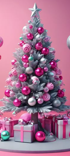 a christmas tree with pink and silver ornaments on it's top, surrounded by presents