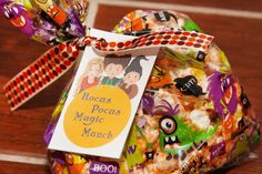 a bag filled with lots of candy on top of a wooden table