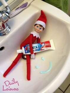 an elf is sitting in the sink with toothpaste