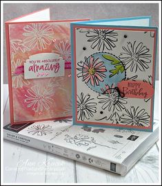 two cards with flowers on them, one has an envelope and the other is a card