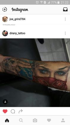 a man's arm with tattoos on it and an image of a woman in the background