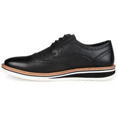 A dress shoe that combines high-style with all-day comfort, the Warrick by Vance Co. A wingtip accent and a contrasting textured design enhanced with brogue details tops this lace-up derby. Smooth vegan leather, a lightweight EVA outsole, and a 4 mm memory foam footbed provide superior support. Black Brogue Dress Shoes For Fall, Fall Black Brogue Dress Shoes, Black Dress Shoes With Brogue Detailing For Fall, Black Oxfords With Contrast Sole For Work, Black Oxfords With Contrast Sole For Spring, Business Casual Black Oxfords With Textured Sole, Black Wingtip Oxfords With Textured Sole, Wingtip Dress Shoes With Perforations For Workwear, Classic Dress Shoes With Perforations For Work