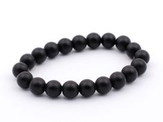 "This is matte black onyx bracelet is made of 8 mm beads. Lovely and elegant bracelet! All of the beads have been strung on high-quality elastic cord. There are no metal elements in the bracelet. You will love this! BLACK ONYX gives strength. It promotes vigor, steadfastness and stamina. Imparts self-confidence, helping you to be at ease in your surroundings. Onyx banishes grief, enhances self-control and stimulates the power of wise decision-making. It encourages happiness and good fortune. Ony Classic Black Bracelets With 8mm Beads, Minimalist Black Onyx Beaded Bracelets, Classic Black Beaded Bracelets As Gift, Minimalist Black Onyx Bracelet, Black Onyx 8mm Beads Jewelry, Black Onyx 8mm Bead Jewelry, Black Onyx Jewelry With 8mm Beads, Classic Black Onyx Bracelets, Classic Black Onyx Bracelet