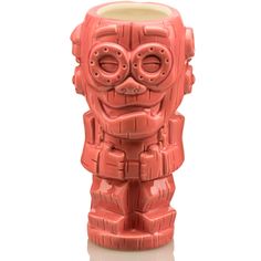 a red ceramic tiki mug with two eyes