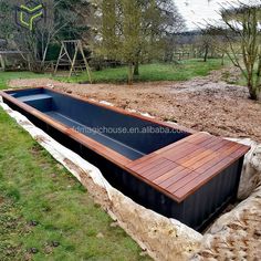 an outdoor swimming pool made out of shipping containers