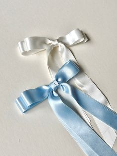 "Looking for the perfect transitional accessory for your reception? Need Something Blue? These 100% Silk Satin bows are next level luxury. The Warm White is natural, not too optic and not too cream.  Made with High Quality Silk Satin Ribbon, it's delicate and double faced. Please read descriptions for size/proportion and fastener specifications, as these are made to order.  Note: Silk Satin is delicate. Handle with extreme care to avoid snags. I recommend spraying your hairspray before applying Luxury Silk Bow For Formal Occasions, Luxury Silk Bow In Elegant Style, Blue Bow Aesthetic, Blue Ribbon Aesthetic, Luxury Ribbon Bow For Wedding, Luxury Classic Satin Bow, White Satin Hair Bow, Bridal Bow, Blue Coquette