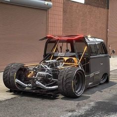 an off - road vehicle is parked on the side of the street in front of a building