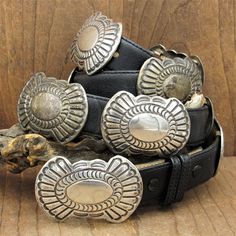 "Southwest vintage sterling silver concho belt. The buckle and each concho are 2 1/4\" long x 1 1/2\" wide. Two strips of copper on the back of each piece allows you to slide them to where you want them on the leather. The belt is 7/8\" wide and 38\" long. The buckle is stamped sterling. Some pieces have lots of patina and some were polished. If you want them all polished, please let us know. There are some surface scratches on the center shiny areas. The belt is in good condition otherwise. It Turquoise Belt, Aquamarine Gem, Top And Jeans, Concho Belt, Levi’s 501, Suspender Belt, Native American Art, Silver Turquoise, American Art