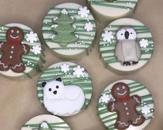 decorated cookies in the shape of animals and snowflakes