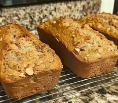 three pieces of bread cooling on a rack