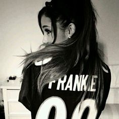 a woman with long hair wearing a t - shirt that says i thank me 30