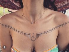 a woman with a tattoo on her chest