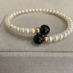 Culture Pearl 2 Gold Beads With 2 Large Black Onyx Beads. Beautiful & Very Comfortable Elegant Black Beaded Bracelets, Elegant Onyx Beaded Bracelets With Black Beads, Elegant Black Beaded Bracelets With 8mm Beads, Elegant Black Bead Round Bracelets, Elegant Black Beaded Bracelets Gift, Elegant Black Beads Bracelet For Formal Occasions, Elegant Black Beaded Bracelets For Formal Occasions, Elegant Hand-strung Onyx Beaded Bracelets, Elegant White Bracelets With Black Beads