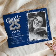 a blue and silver 25th birthday party card with a photo on the front that says cheers to 25 years