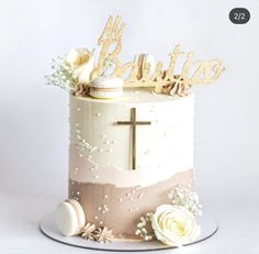 a cake decorated with flowers and a cross