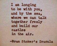 an old typewriter with the words i am longing to be with you, and by the sea, where we can talk together freely and build our castles in the air