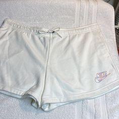 Nike Shorts. Nwot, Brand New, Never Worn. So Practical And Comfortable, You’ll Wear Them All Summer, Perfect For Your Next Vacation! Elastic Drawstring Waistband With Two Side Pockets And Nike Swoosh Logo On Left Side. 80% Cotton/20% Polyester. Machine Washable. Smoke Free Home. Trendy White Leisure Bottoms, Casual White Drawstring Bottoms, Casual White Bottoms With Drawstring, Comfortable White Shorts For Spring, Comfortable White Spring Shorts, White Drawstring Shorts For Loungewear, White Leisure Shorts, Casual White Shorts For Leisure, Casual White Bottoms For Leisure