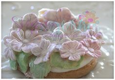 a close up of a pastry with flowers on it