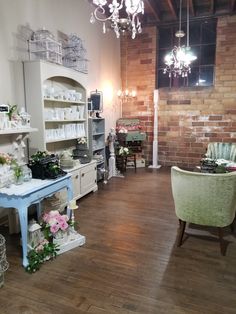 the inside of a store with tables, chairs and other items on display in it