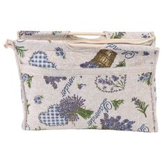 a blue and white bag with flowers on it