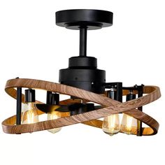 a wooden light fixture with three lights hanging from it's center and two arms