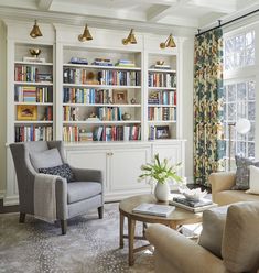 a living room filled with lots of furniture and bookshelves covered in bookcases