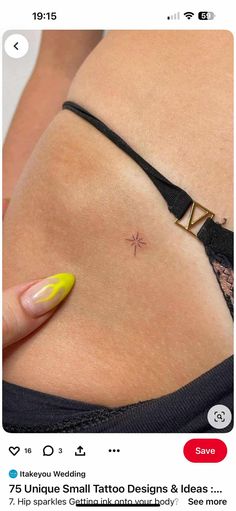 a woman's stomach with tattoos on it and a yellow manicured nail polish