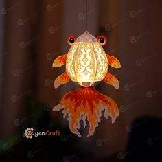 a lantern shaped like a fish hanging from the ceiling