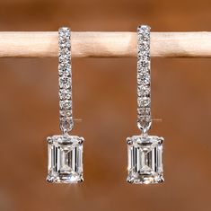 Emerald Cut Lab Grown Diamond Dangling Earrings, Dangle and Drop Wedding Earrings for Women, Emerald Diamond Earrings , Halo Diamond Earrings, Emerald Cut Perfect Diamond Earrings, Drop Dangle Wedding Earrings, Lever Back Earrings, Wedding Gift For Her, Wedding Earrings For Brides, Halo Dangle Earrings For Her, Gift For Mother, Gift For Daughter, Lab Grown Diamond Earring For Women 𝐖𝐞 𝐆𝐮𝐚𝐫𝐚𝐧𝐭𝐞𝐞𝐝 𝐎𝐮𝐫 𝐋𝐚𝐛𝐠𝐫𝐨𝐰𝐧 𝐃𝐢𝐚𝐦𝐨𝐧𝐝𝐬 𝐚𝐧𝐝 𝐉𝐞𝐰𝐞𝐥𝐫𝐲 𝐏𝐫𝐢𝐜𝐞𝐬 𝐀𝐫𝐞 𝐋𝐨𝐰𝐞𝐬𝐭 𝐎𝐧 𝐄𝐭𝐬𝐲.𝐁𝐞𝐜𝐮𝐬𝐞 𝐊𝐡𝐚𝐦𝐤𝐚𝐫𝐝𝐢𝐚𝐦𝐨𝐧𝐝 𝐈𝐬 𝐌𝐚𝐧𝐮𝐟𝐚𝐜𝐭𝐮𝐫𝐞𝐫 𝐎𝐟 𝐋𝐚𝐛𝐠𝐫𝐨𝐰𝐧 𝐃𝐢𝐚𝐦𝐨𝐧𝐝.𝐖𝐞 𝐀𝐫𝐞 𝐍𝐨𝐭 𝐀 𝐓𝐫𝐚𝐝𝐞𝐫 𝐎𝐫 𝐍𝐨𝐭 𝐀 𝐌𝐞𝐝𝐢𝐚𝐭𝐨𝐫.𝐂𝐨𝐦𝐩𝐚𝐫𝐞 𝐏𝐫𝐢𝐜𝐞 𝐀𝐧𝐝 𝐐𝐮𝐚𝐥𝐢𝐭𝐲 𝐎𝐟 𝐃𝐢𝐚𝐦𝐨𝐧𝐝 𝐓𝐨 𝐎𝐭𝐡𝐞𝐫 𝐒𝐞𝐥𝐥𝐞𝐫. ❋𝐃𝐫 Gia Certified Diamond Drop Earrings, Gia Certified Dangle Earrings, Sterling Silver Earrings With Baguette Cut And Prong Setting, Classic Gia Certified Dangle Jewelry, Gia Certified Dangle Wedding Earrings, Anniversary Prong Setting Dangle Earrings, Gia Certified Dangle Earrings For Wedding, Anniversary Dangle Earrings With Prong Setting, White Gold Diamond Drop Earrings With Bail