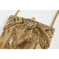 Rare vintage Whiting & Davis Co. gold mesh chainmail purse with frame that features a centralized face among leaves and flowers.  It has a gold chain that is approximately 15" from the top on the bag to the shoulder area and the total length with bag and chain is 23".  The height of the bag without the chain is 8.12".   Inside is a Whiting & Davis Co. tag. Elegant Chainmail Bag, Victorian Gold Bag For Party, Victorian Gold Party Bags, Gold Evening Bag With Gold-tone Hardware For Gala, Victorian Gold Evening Bag For Party, Antique Gold Bag For Vintage Events, Gold Antique Bag For Vintage Events, Antique Gold Evening Bag, Antique Gold Bags For Vintage Events