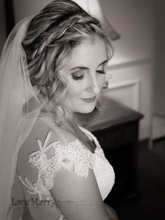 the bride is getting ready to walk down the aisle in her wedding dress and veil