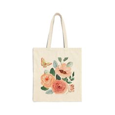 a tote bag with flowers and butterflies painted on the front in pink, orange and green