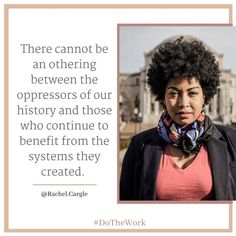 a woman with an afro is in front of a building and has a quote on it