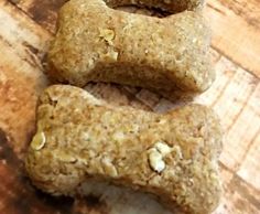 three raw dog treats on a wooden table