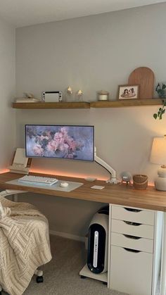 a desk with a computer monitor and keyboard on it